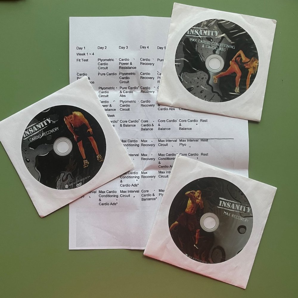 Set of 10 "Insanity Work Out" DVD’s